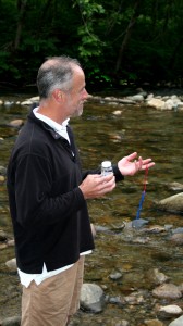 Frank Kelly with a collection bottle and an air/water thermometer.
