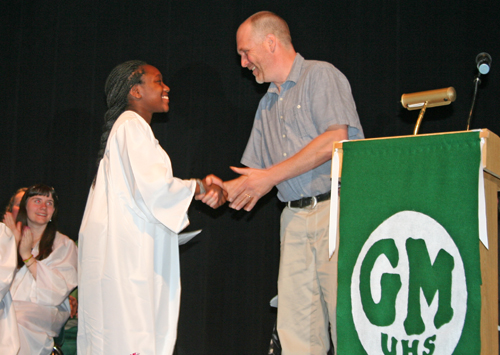 Cheyenne Prescott is presented with the first Heath Gordon Scholarship for Music and the Arts. John Yake is presenting.