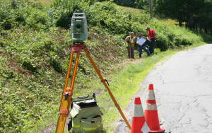 Chester Highway Superintendent Graham Kennedy (center) works to lay out new Popple Dungeon Road section.