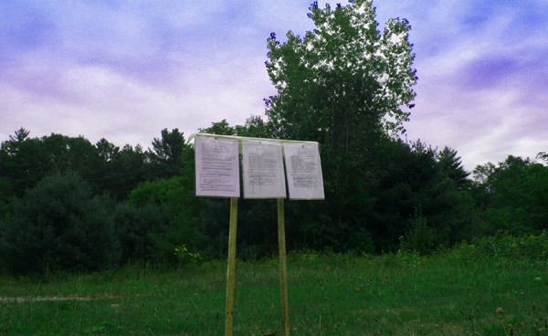 Building permits are posted on Zachary property on Main Street. Its purchase is soon to be completed by the Zaremba Group for a Dollar General store. Photo by Shawn Cunningham.
