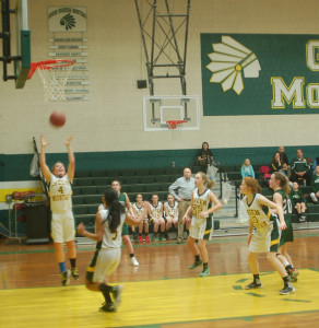 Kassidy Cummings is under the ball, surrounded by teammates Maya Lewis, No. 5, Reilly Merrill, No. 24, and No. 10 Annie Lamson.