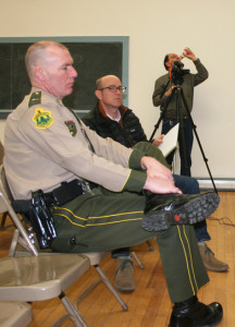 Vermont State Police Lt. Tim Oliver, foreground, and Peter Pagnucco of the Londonderry Policing Committee talk about the contract that voters approved at Town Meeting. Photos by Cynthia Prairie