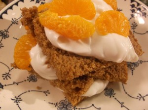Layer  carrot-Mandarin orange cake with orange slices and a lighter cream cheese icing.