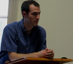 Kyle Rogstad speaks to the Select Board about his plan for a new government website.