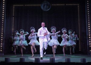 "We're in the Money." "Wig and makeup design by Erin Kennedy Lunsford creates the look and feel of early sound films, while Ed Chapman’s sound design is thankfully modern, crisp and clear."