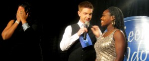 From left, Michelle Brooks-Thompson realizes she has won 1st Place as emcee Jared Goodell tells Prescott she has come in 2nd Place. 