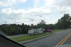 Veliz shows what the actual height of the Dollar General will be with this line drawing on top of a photo he took.