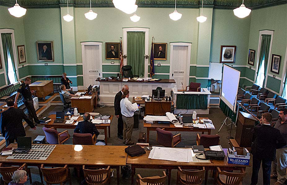 A recess in Tuesday's proceedings: On the left, architect and Smart Growth member Claudio Veliz, Deputy Sheriff Trevor Dickerman and court clerk Jackie Fletcher. Center, Zaremba attorney Alan Biederman speaks with landscape architect Michael Buscher. Far right, Zaremba attorney David Cooper and engineer Chris Ponessi.