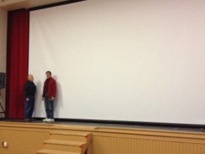 From right, Ralph Pace and David Almond stand in front of the new giant screen at the Ludlow Auditorium..