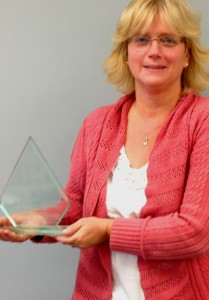 Pam O'Neil holds the James F. Cawley Award. Photo provided.