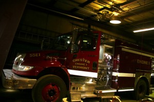 Fire Chief Matt Wilson sits in the cab of the new Chester fire truck to confer with radio expert Carl Noe, who is in the passenger seat. Photos by Cynthia Prairie