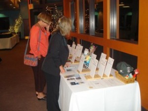 Guests enjoying bidding s at last year's BRAM'S  Silent Auction.