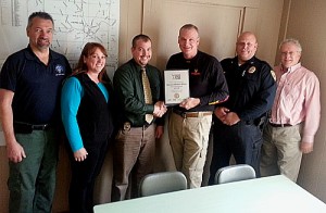 From left: David C. Flight of Riley's Law Enforcement Supply; Amber Wilson, wife of Det. Wilson; Det. Matthew Wilson; Bill Lacaillade of Safariland; Chester Police Chief Richard Cloud and town manager David Pisha. Photo provided.