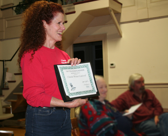 Julie Pollard shows the Chester Select Board the certificate the Winter Carnival received naming it one of the Top 10 Winter Events in Vermont.