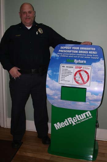 Chester Police Chief Rick Cloud shows off the new MedReturn drug drop-off box at Town Hall.