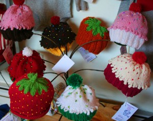 Cupcake and berry hats at Sage Jewelry.