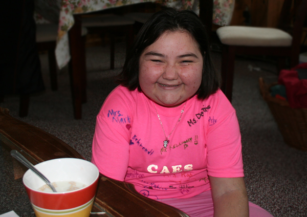 Lindsey Sturtevant happily wears her bright T-shirt from friends and teachers at Chester-Andover Elementary School.