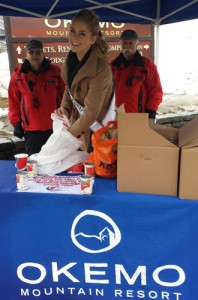 Miss Vermont Teen USA, Madison Cota of Bellows Falls, center, is flanked by Okemo Mountain Ambassadors Paul Sullivan and Robert Kischko as they collect food from skiers as part of the Okemo Cares and Shares spring food drive. Photo provided.
