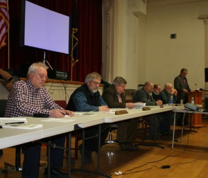 From left, town manager David Pisha and Select Board members John DeBenedetti, Tom Bock, Derek Suursoo, Bill Lindsey and Arne Jonynas with town moderator Bill Dakin.