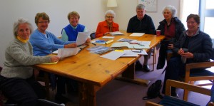 Several members of the Chester Beautification Committee plot positions for new floral planters. They are, from left, Lillian Willis, Rosann Sexton, Jane Davis, Barb  Westine, John McAveeney, Cheryl LeClair and Tory Spater. Click photo to enlarge.