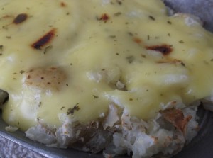 Baked mashed potatoes with horseradish sauce.