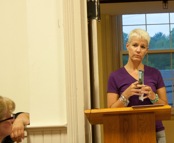 Wendi Germain of the listens to an audience member during a Select Board meeting focusing on transitional housing. Photos by Shawn Cunningham