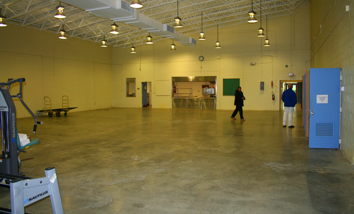 This large multipurpose room off the kitchen also has a rolling door.