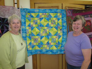Lynn Way and Barbara Windham of Chester and members of the Quiet Valley Quilters’ Guild.