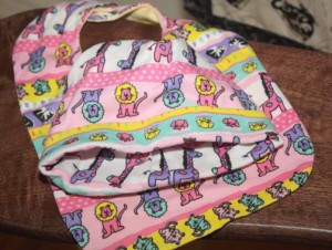 Harris sews many items for the RAC including baby cap and bib sets.