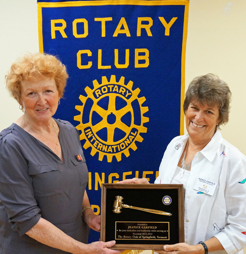 Carol Cole, newly installed president of the Springfield Rotary Club for 2014-15, left, presents outgoing President Jeanice Garfield with a plaque in recognition of her service. Photo provided.