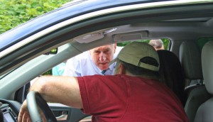 Gov. Shumlin can be seen through the passenger's seat window speaking with driver Dennis Rounds as he heads out on an errand.