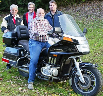 Springfield Rotarians Ed McQuade, Bob Flint and Buddy Dexter stand behind Ronald Bingham and the 1984 Honda GoldWing motorcycle that he is donating.