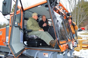 Hawks Mountain Ridge Riders Vice President Barry Messer, seated right, shows USDA Rural Development state director Ted Brady around the cab of the new Sno-Cat purchased in part using a $77,000 Rural Business Enterprise Grant. 