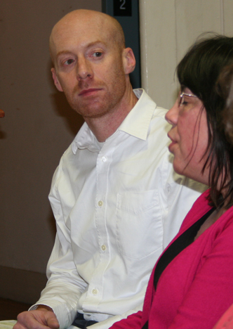Eric Law, right, listens as Naomi Johnson talks about the water plan. Photos by Shawn Cunningham