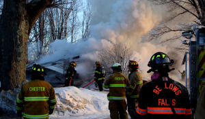 Firefighters from at least 10 neighboring companies turned out to help fight the blaze. Claudio Veliz photo.