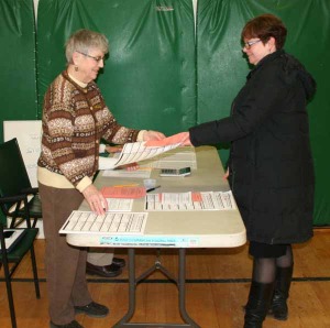 A Grafton voter picks up ballots around 6 p.m. on Tuesday.