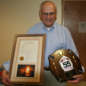 Retiring Chief Harry Goodell with a town proclamation and plaque he received on Saturday night. 