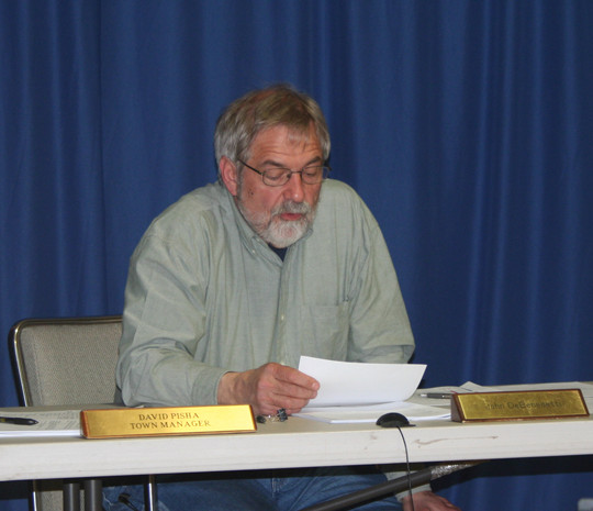 Chester Select Board chair John DeBenedetti reads the warning that voters are to address on Tuesday, May 19.