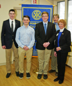 A possible caption for the pic is "Springfield High School's participants in the Rotary Club's 4-Way Speech Contest, Patrick Clancy, David Bryant III and Tre Ayer, with Springfield Rotarians Bob Flint and Carol Cole."