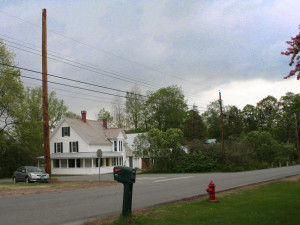 The Big Pole, left, stands about 4 feet above neighboring telephone poles. Photo by Cynthia Prairie