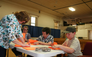 Town Clerk Deb Aldrich, Select Board Member Heather Chase, Justice of the Peace Ruthie Douglas and a Cody check the counts for the water project vote.