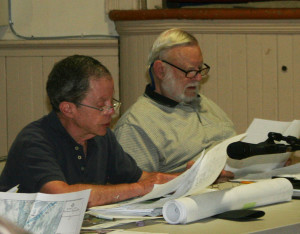 DRB member Phil Perlah, left,  questions the flood map and the hazard possibilities of buried tanks among other items. Member Don Robinson listens. All photos by Cynthia Prairie.