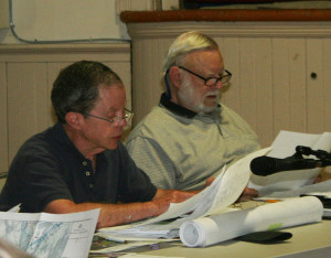 DRB member Phil Perlah, left, questions the flood map and the hazard possibilities of buried tanks among other items. Member Don Robinson listens. All photos by Cynthia Prairie.