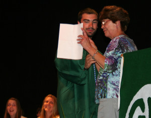 Joseph Epler accepts the Hart Scholarship from his aunt Elaine Hart.