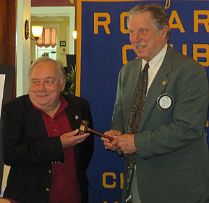 Brian Morris, left, passes the gavel to new Chester Rotary President Bill Dakin. 