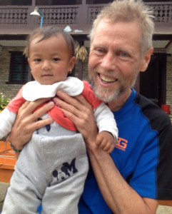 T. Breeze Verdant holding a Nepalese child.