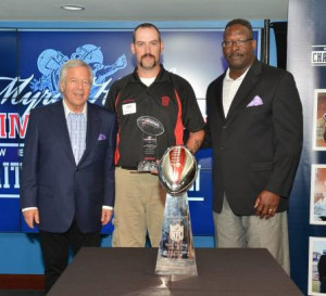 From left, Patriots chairman and CEO Robert Kraft, Proctorsville firefighter Bob Glidden Jr. and Patriots and Pro Football Hall of Famer Andre Tippett .