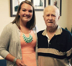 Photo caption Roger Neal, husband of the late Eileen Austin Neal, RN, presents scholarship award to Natalie Wilson at Springfield Hospital.