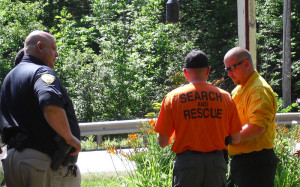 Chester Police Chief Rick Cloud and Fire Chief Matt Wilson confer with Vermont State Police Search and Rescue on a plan around 11 a.m.