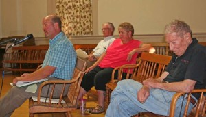 Champlain Oil's Matt Wamsganz, seated front, speaks architecture of the proposed Jiffy Mart. Behind him from left are Tony Cairns, company president, Joni Goss, store manager, and Chester resident Robert Haas. All photos by Cynthia Prairie. Click a photo to launch the gallery.